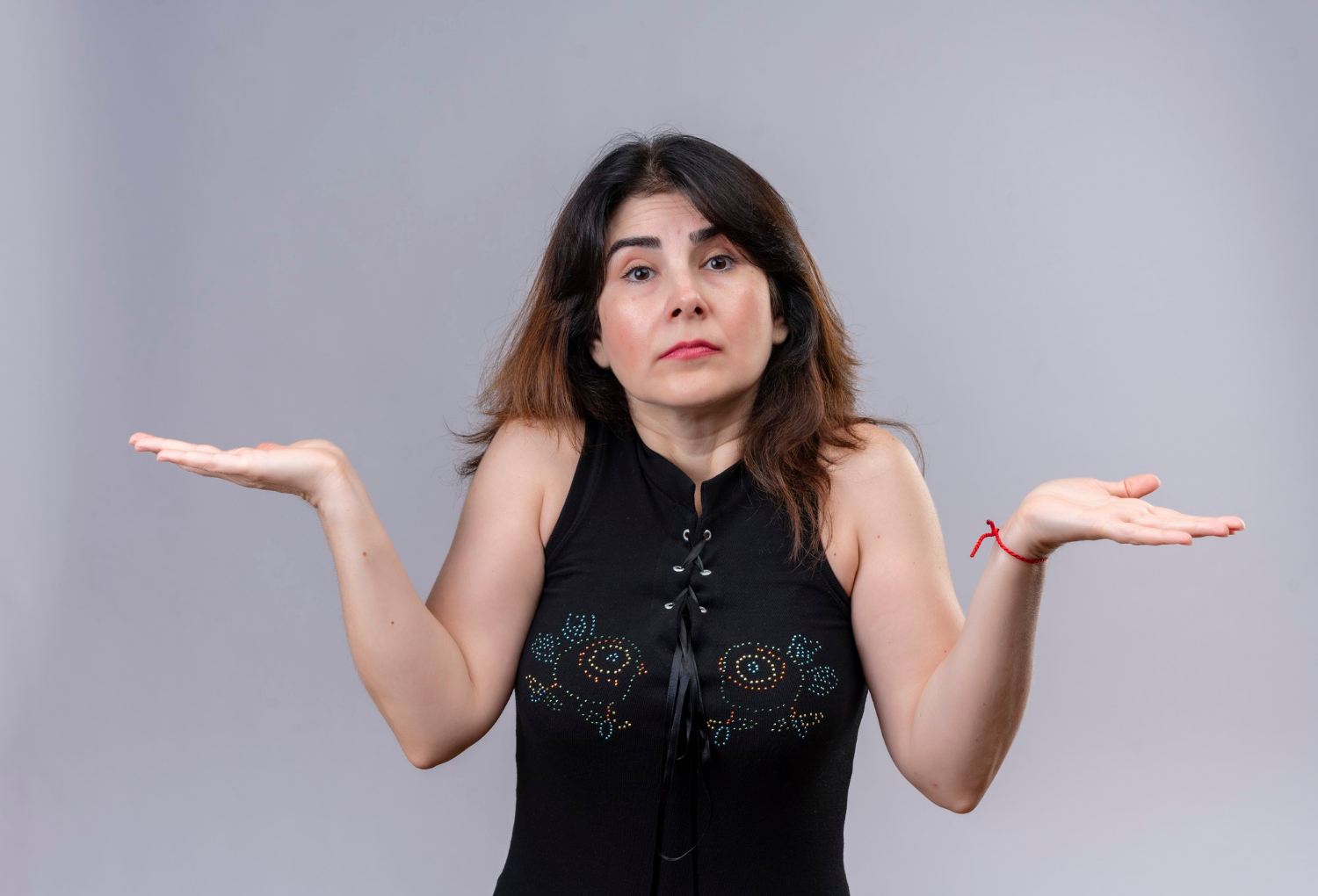 A woman shrugging | Source: Freepik