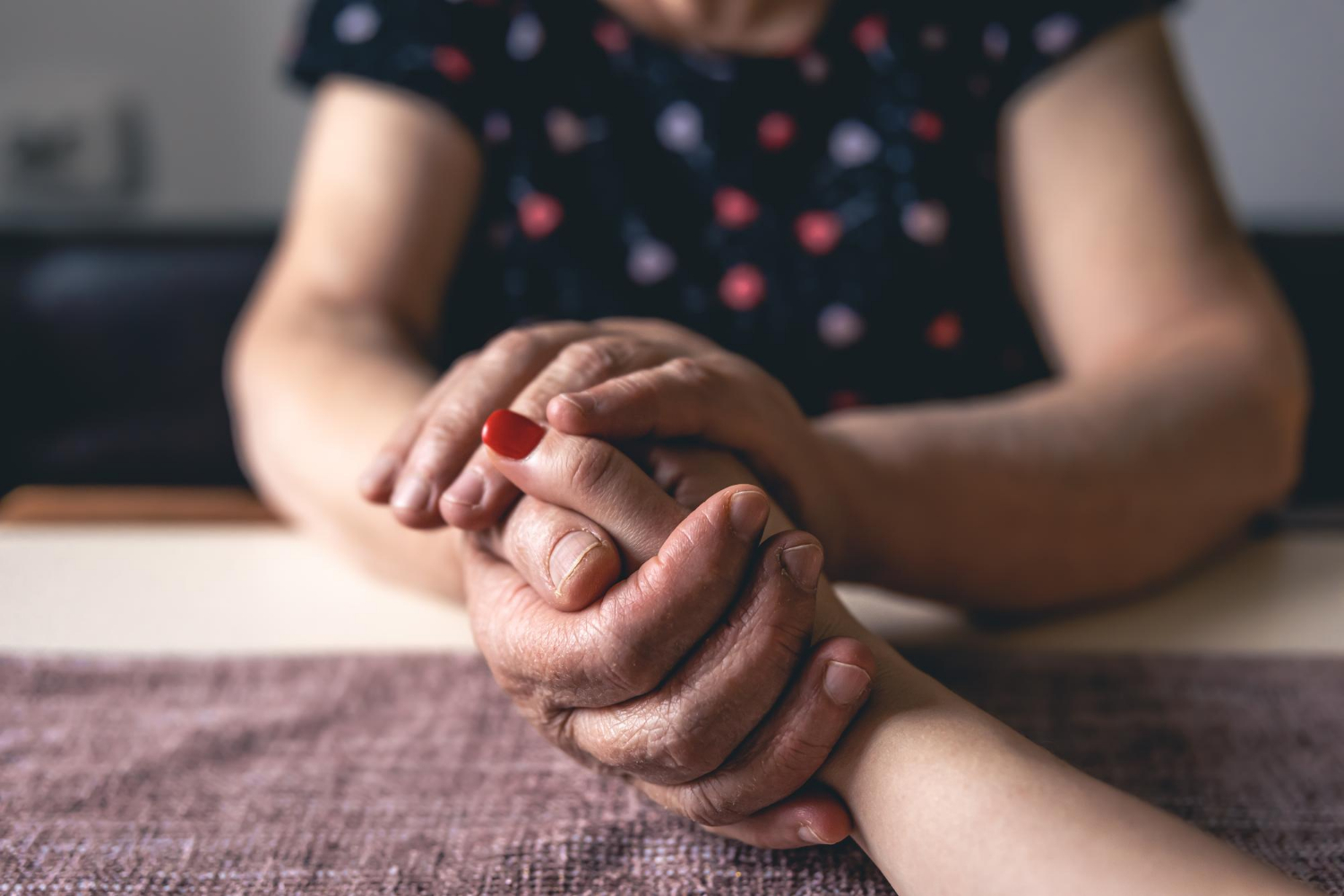 Close-up shot of two women holding hands | Source: Freepik